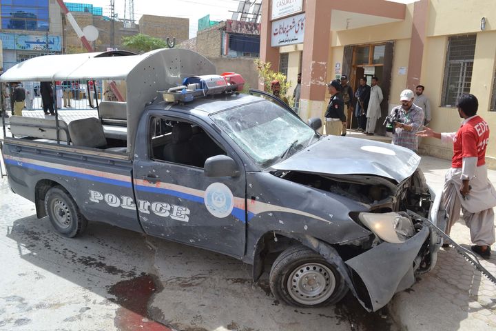 A damaged police car is seen after a blast near Al-Khair Hospital on Zarghoon Road in Quetta, Pakistan on Thursday.