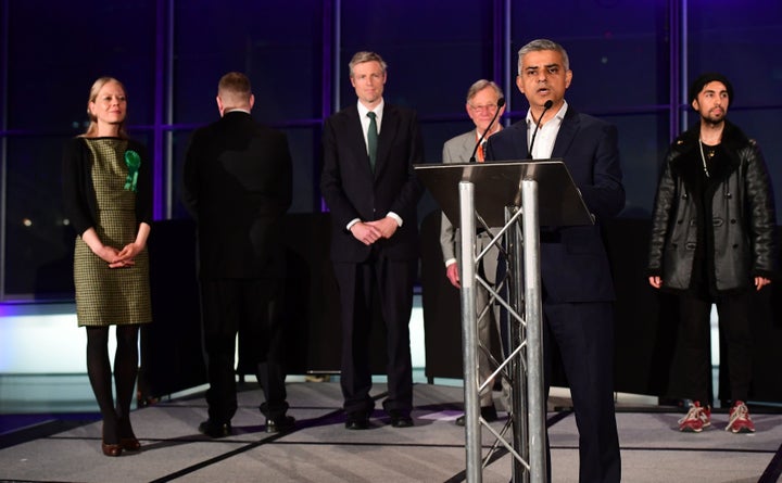 Britain First candidate Paul Golding (second left) turns his back as Sadiq Khan speaks onstage at the declaration of results in the London Mayor election.