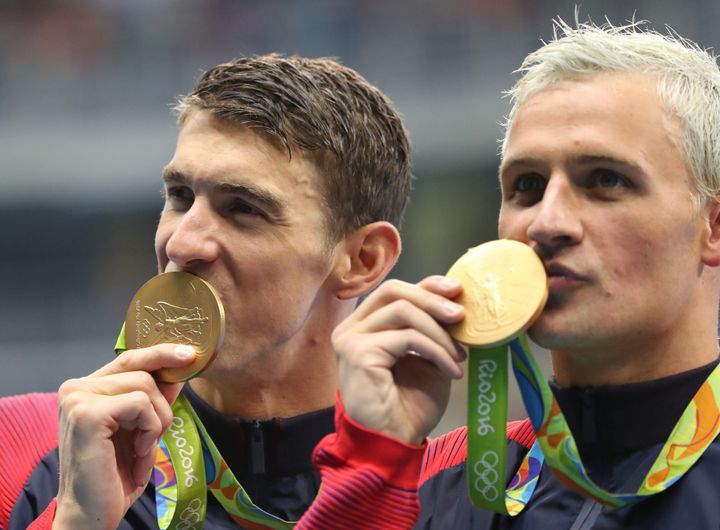Michael Phelps and Ryan Lochte celebrate winning the gold medal during the swimming competitions at the 2016 Summer Olympics in Rio de Janeiro, Brazil.