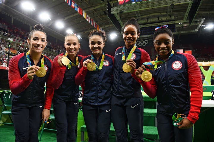 American gymnasts Aly Raisman, Madison Kocian, Lauren Hernandez, Gabrielle Douglas and Simone Biles pose with their medals on Aug. 9.