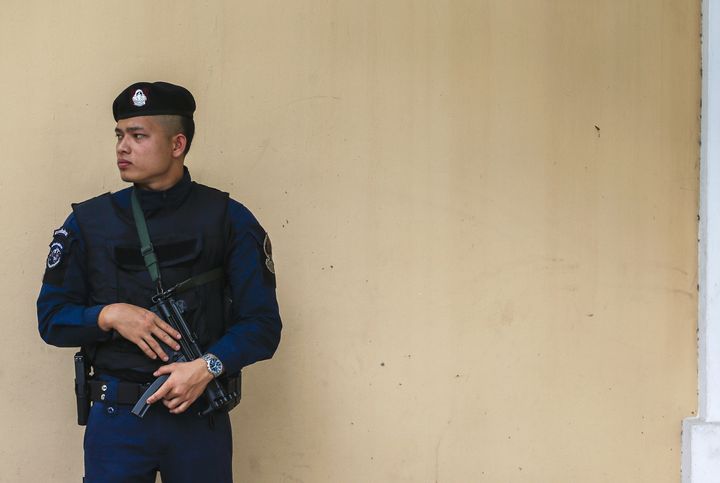 A police officer stands guard outside the Russian Embassy in Bangkok, Thailand, December 4, 2015.