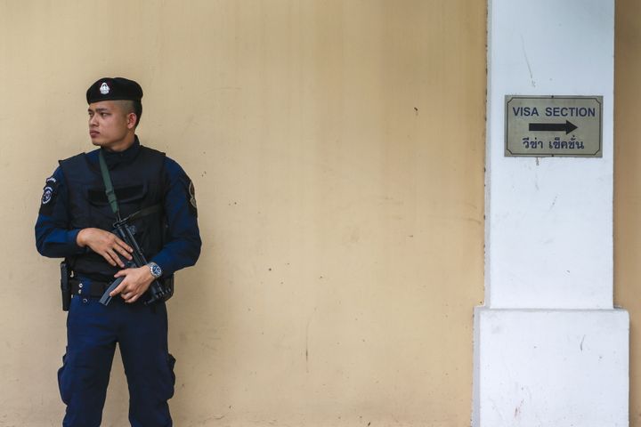 A police officer stands guard outside the Russian Embassy in Bangkok, Thailand, December 4, 2015.