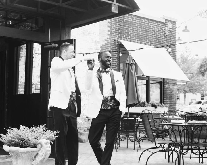 Eric and David take a moment to dance outside in the sun after celebrating their wedding together.