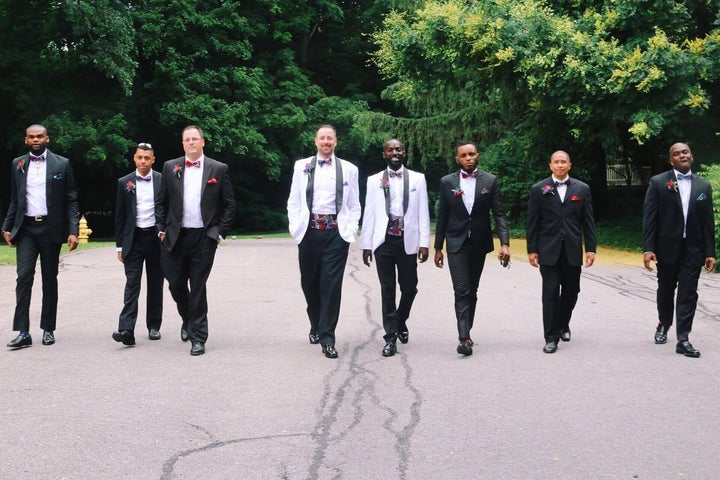 The groomsmen take a stroll before the reception.