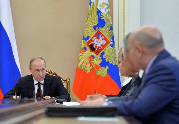 Russian President Vladimir Putin chairs a meeting with members of the Security Council at the Kremlin in Moscow, Russia, July