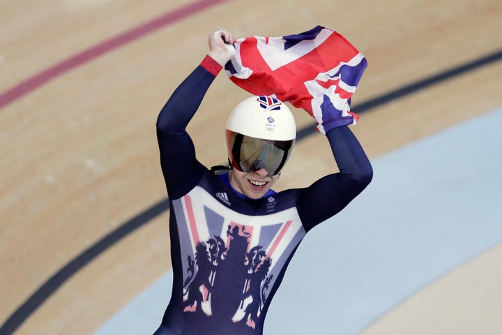 Philip Hindes of Great Britain celebrates after winning gold in the men's team sprint finals at the Rio Olympic Velodrome.