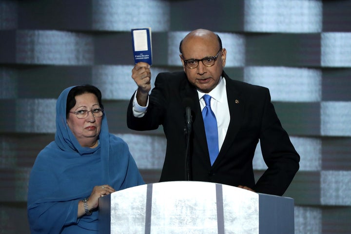 Khizr Khan holding up a copy of the Constitution at the Democratic National Convention on July 28, 2016. Ghazala Khan (L) stood at his side, but did not speak.