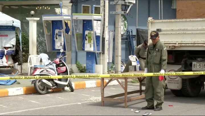 <strong>Police Explosive Ordnance Disposal official inspects the site of a bomb blast in Hua Hin</strong>