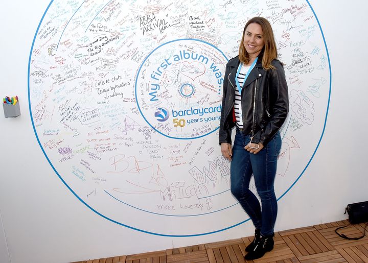 Mel always brought some credibility to the group. Here she is in front of a giant Barclaycard sign