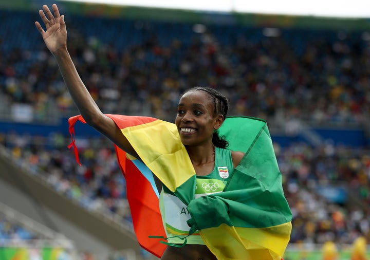 Ayana celebrates winning the Women's 10000 Meters Final on Friday.