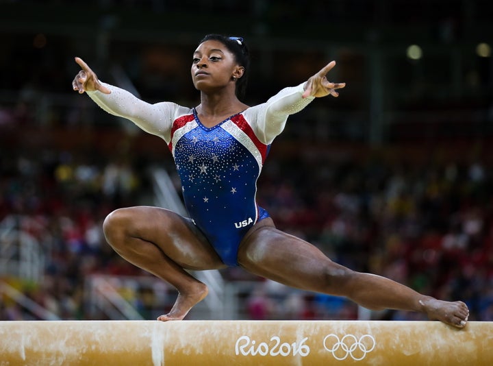 Simone Biles of the USA performs her balance beam routine during the artistic gymnastics women's individual all-around final event at the 2016 Summer Olympic Games. 