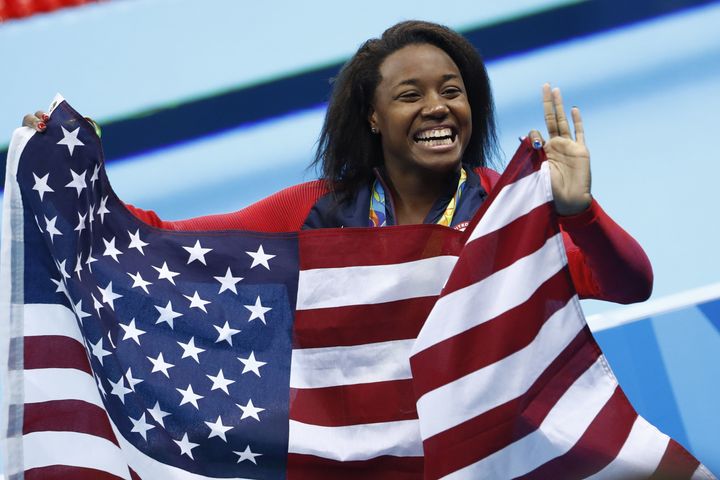 Gold medalist USA's Simone Manuel celebrates her historic win at the Rio 2016 Olympic Games.