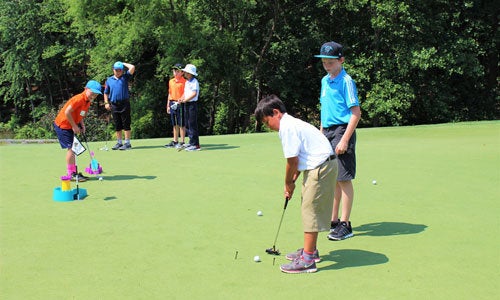 Children participate in the Trumpeteers program at the Trump National Golf Club Charlotte.