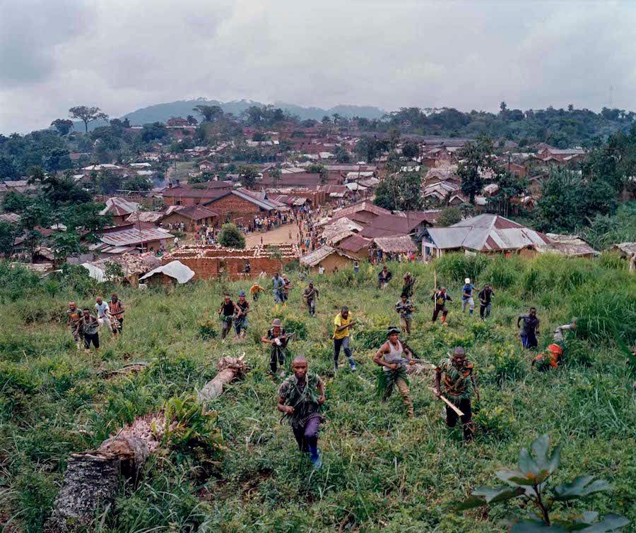 Dec. 18, 2013. Lulingu, South Kivu, Democratic Republic of the Congo. On the hills above Lulingu town, fighters demonstrate an attack.