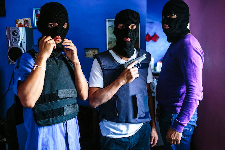 March 22, 2015. Caracas. A gang from Western Caracas poses for a portrait at one of their stash houses in the barrio. Crime, armed robbery, and kidnapping are rampant in the city. The Venezuelan Violence Observatory, which tracks violence statistics in the country in lieu of the government that does not, numbers homicides in the country at nearly 25,000 in 2014 — making it the second highest peacetime murder rate in the world.