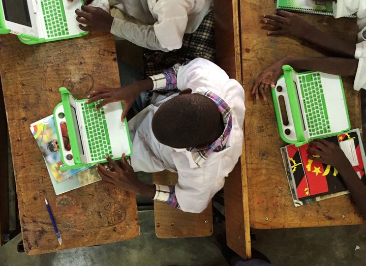 Children work on laptops provided by Angola's sovereign wealth fund at a Dom Bosco Catholic mission school in Luanda's impoverished Sambizanga neighbourhood, Angola June 7, 2016. REUTERS/Ed Cropley