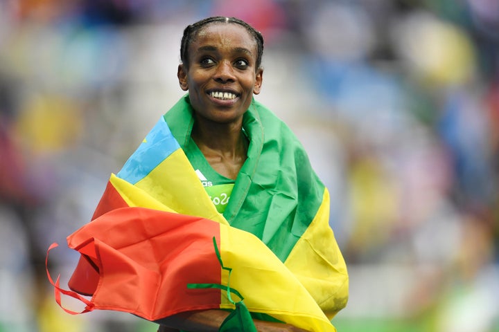 Almaz Ayana of Ethiopia reacts to winning the gold and setting the world record (29:17.45) in the women's 10,000-meter race.