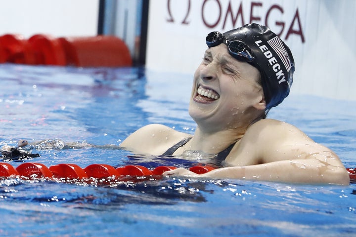 Katie Ledecky celebrates after she broke the world record to win the Women's 800m Freestyle Final during the swimming event at the Rio 2016 Olympic Games.