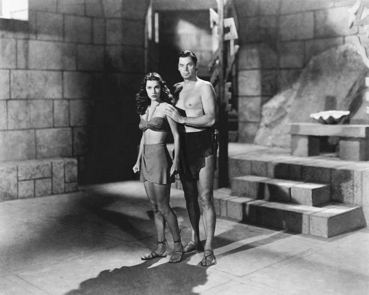 Johnny Weissmuller (1904 - 1984) as Tarzan, and Brenda Joyce (1917 - 2009) as Jane, in 'Tarzan And The Mermaids'.