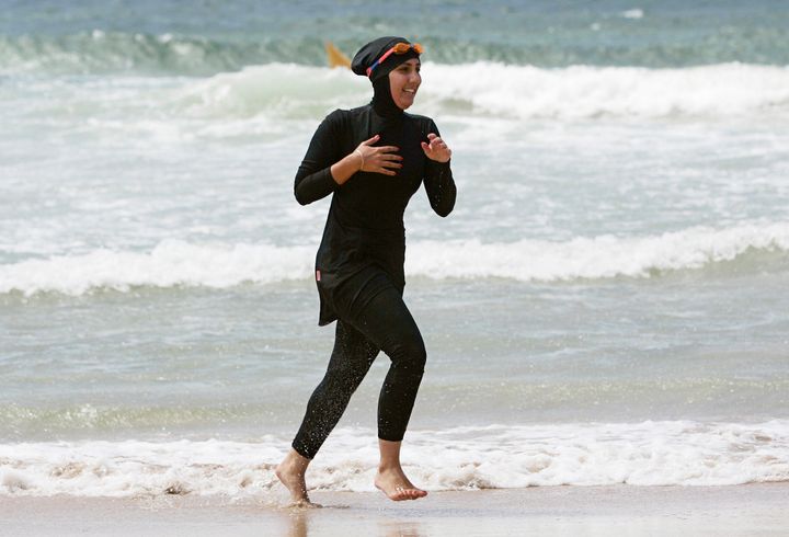 Mecca Laalaa, a volunteer with a surf lifesaving patrol in Sydney, runs on the beach in 2007. 