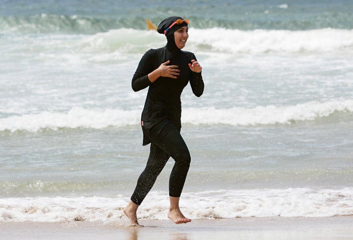 Mecca Laalaa, a volunteer with a surf lifesaving patrol in Sydney, runs on the beach in 2007.