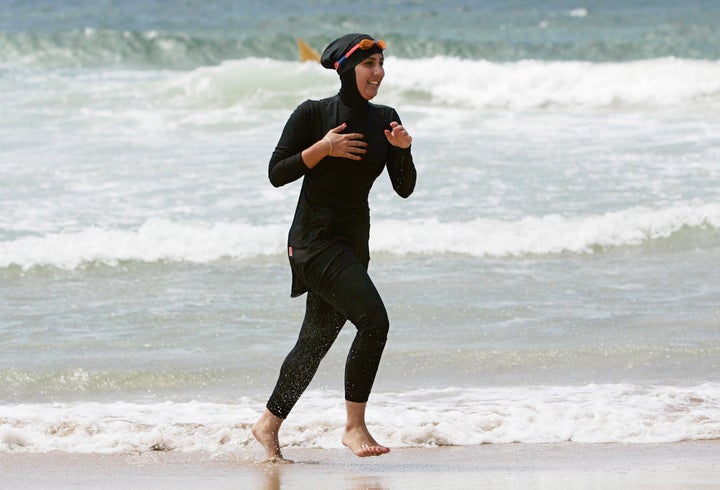 Mecca Laalaa, a volunteer with a surf lifesaving patrol in Sydney, runs on the beach in 2007. 