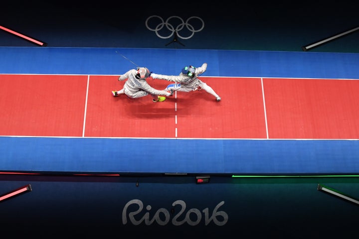 Ibtihaj Muhammad competes against Italy's Rossella Gregorio during the women's team sabre bronze medal bout between.