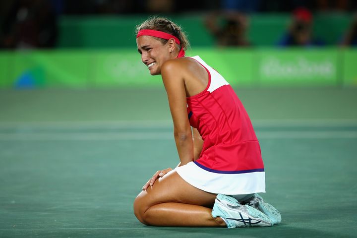 Monica Puig reacts after defeating Angelique Kerber in the Women's Singles Gold Medal Match on Day 8 of the Rio 2016 Olympic Games. 