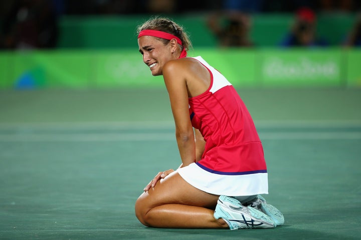Monica Puig of Puerto Rico reacts after defeating Angelique Kerber of Germany in the Women's Singles Gold Medal Match on Day