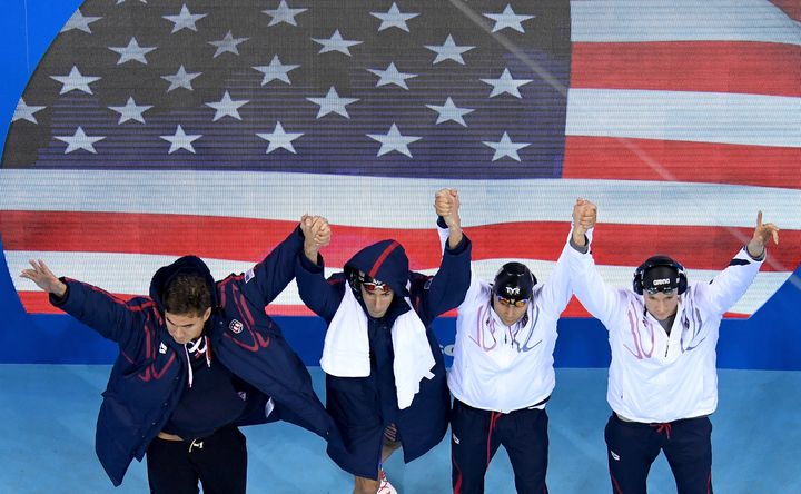 Nathan Adrian, Ryan Murphy, Michael Phelps and Cody Miller of the United States greet the crowd before the men's 4x100 medley relay final.