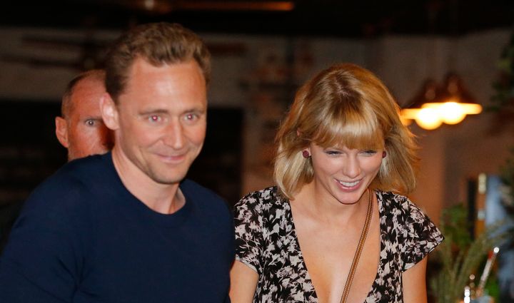 Actor Tom Hiddleston and singer Taylor Swift having a grand old time during Tom's "high profile summer."