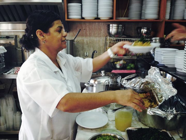Suheila Al Hindi serving hummus at her restaurant in Acre, Israel