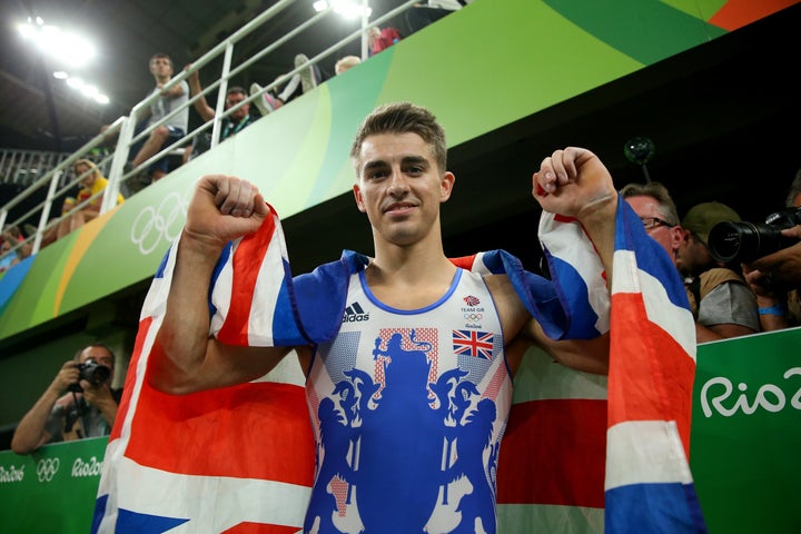 Max Whitlock celebrates winning the gold medal after the men's pommel horse final.