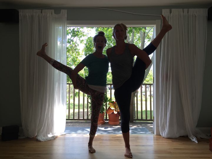 Yoga instructors Abby Vakay and Jesse Falk strike a pose.