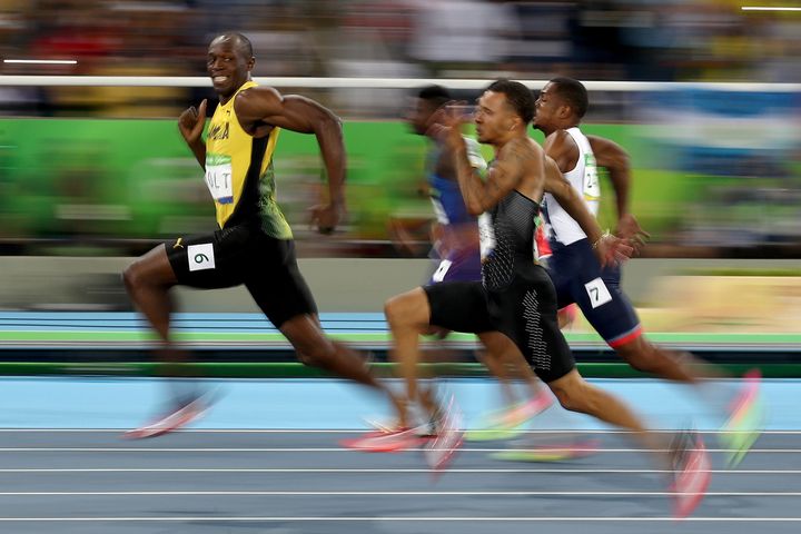 Bolt's meme-worthy grin during Sunday evening's 100-meter dash semi-finals. He cruised ahead of American Justin Gatlin and other competitors in the final to win his 7th Olympic gold.