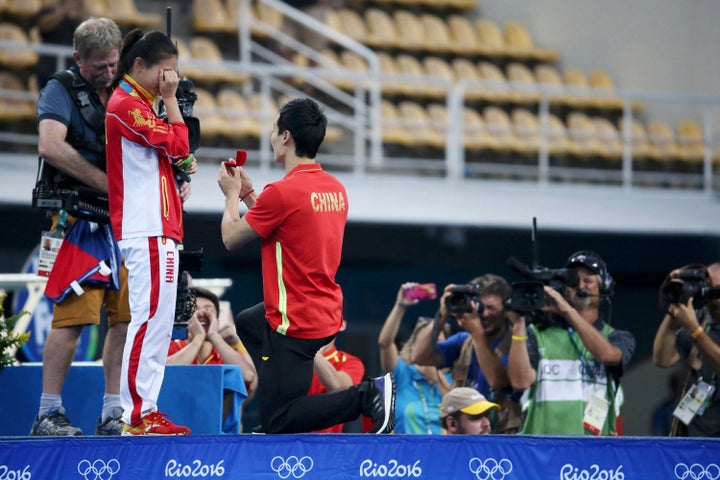 Chinese diver He Zi accepted boyfriend and teammate Qin Kai's proposal shortly after medal ceremony Sunday.