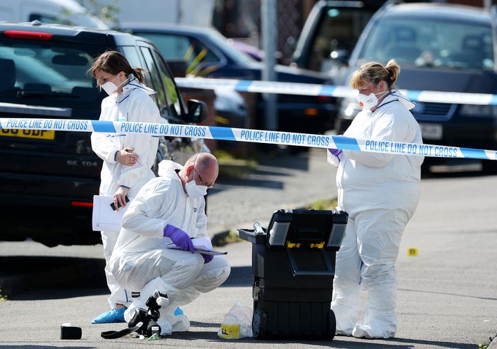 <strong>Forensic officers at the scene outside an address in Meadow Close in the Trench area of Telford.</strong>