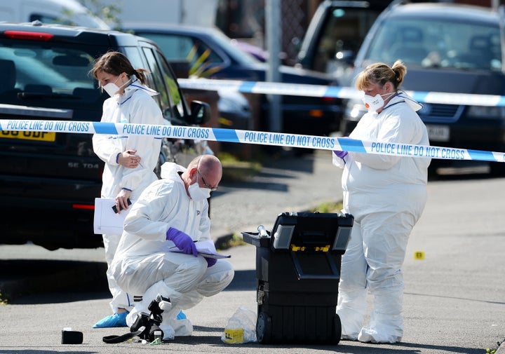 Forensic officers at the scene outside an address in Meadow Close in the Trench area of Telford.