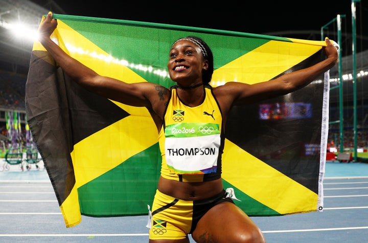 Elaine Thompson of Jamaica celebrates after winning the Women's 100m final. 