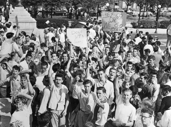 White high school students gather in front of Baltimore City Hall in October 1954, demanding that black students be barred from previously all-white schools.