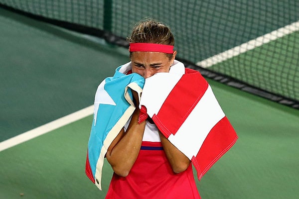 <a href="http://www.wtatennis.com/news/article/5804369/title/puig-wins-historic-gold-for-puerto-rico" target="_blank">Monica
