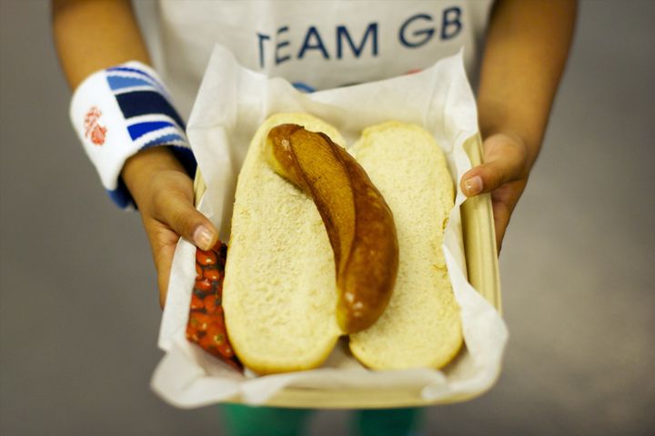 Aug. 10, 2012 - London, England, United Kingdom - A girl holds a sausage lunch at the Spain and Russia semi-final game at the North Greenwich Arena during the 2012 London Summer Olympics.