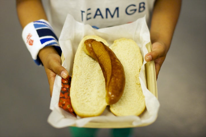 Aug. 10, 2012 - London, England, United Kingdom - A girl holds a sausage lunch at the Spain and Russia semi-final game at the North Greenwich Arena during the 2012 London Summer Olympics.