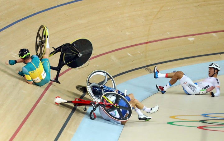 Glenn O'Shea of Australia, Elia Viviani of Italy and Park Sanghoon in the aftermath of the crash.