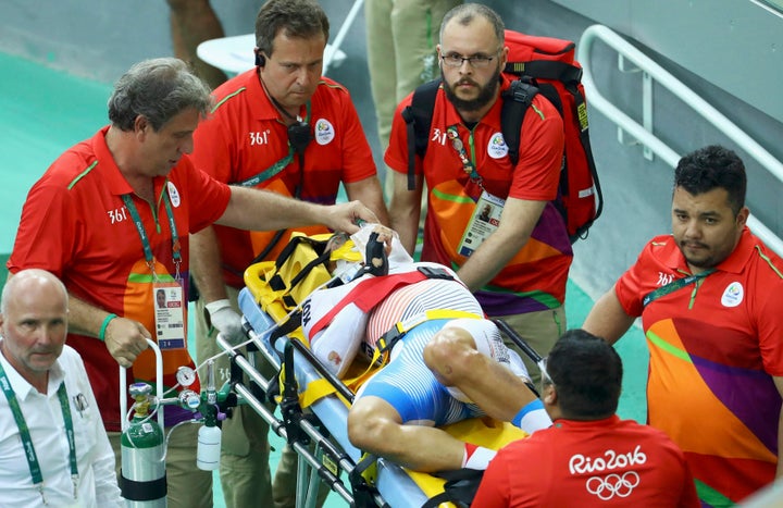 Park Sanghoon being stretchered away from Velodrome.