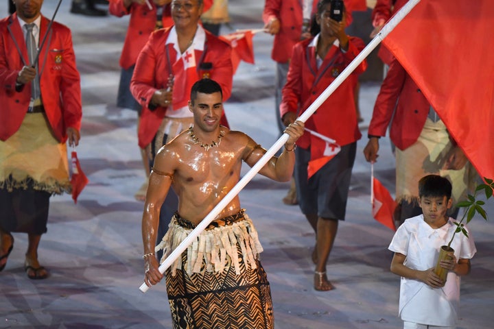 Tonga's flagbearer Pita Nikolas Taufatofua leads his delegation during the opening ceremony of the Rio 2016 Olympic Games at