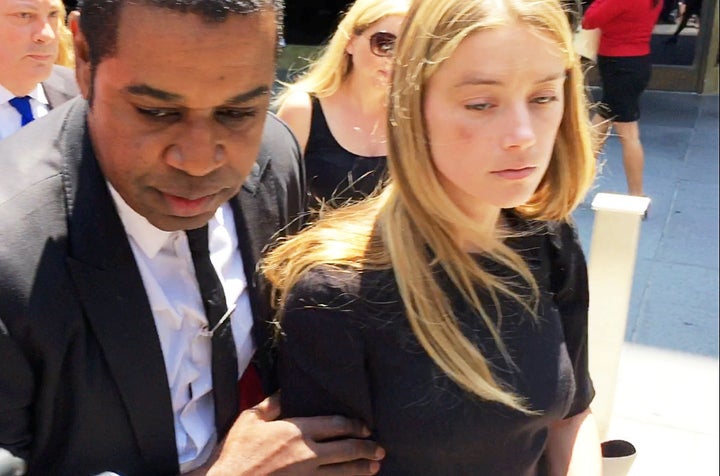 <strong>Amber Heard leaves the Superior Court of Los Angeles on 27 May, 2016 after obtaining a restraining order against husband Johnny Depp.</strong>