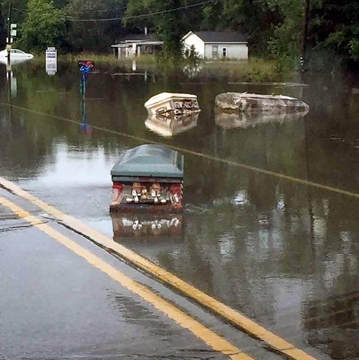 Coffins were wrenched from the soil by the force of the floods 