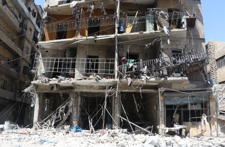 Debris of a building is seen after warcrafts belonging to Syrian and Russian army hit the residential area at Tarik al-Bab neighborhood of Aleppo, Syria on August 16, 2016.