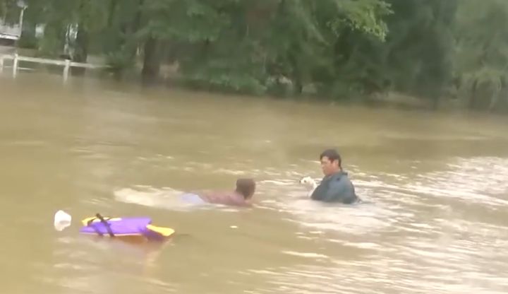 David Phung rescues a woman and her dog from a sinking car in Louisiana.